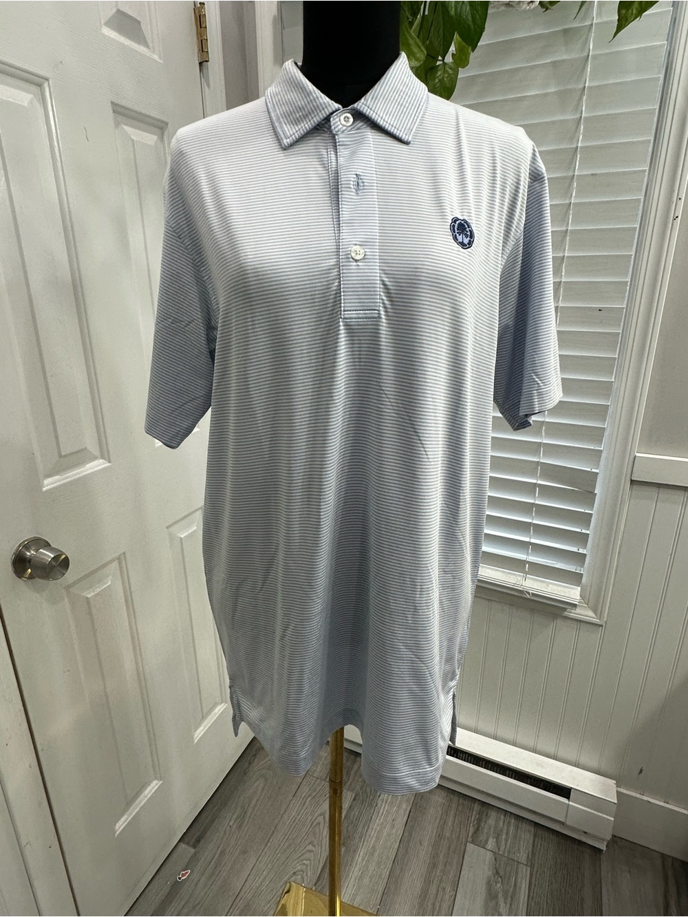 Men's Light Blue Striped Polo with Embroidered Chest Motif